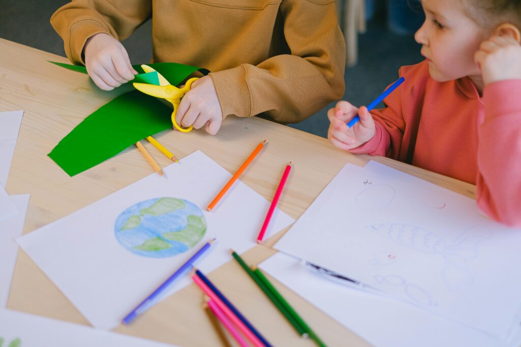 pexels-photo-11286110-11286110 Children explore creativity with drawing and cutting activities focused on ecology.