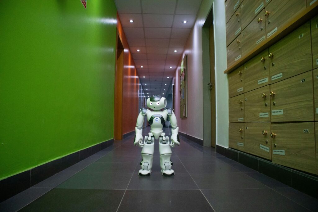 pexels-photo-16544931-16544931 A humanoid robot stands in a vibrant, modern hallway in Lagos, Nigeria.