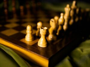 Artistic close-up of wooden chess pieces on a board, perfect for strategy concepts.